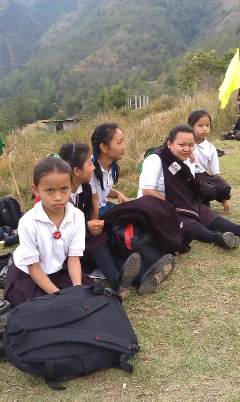 CHILDREN WATCHING THE FOOTBALL MATCH 