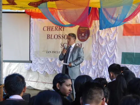 ADMINISTRATOR ADDRESSING THE GATHERING 